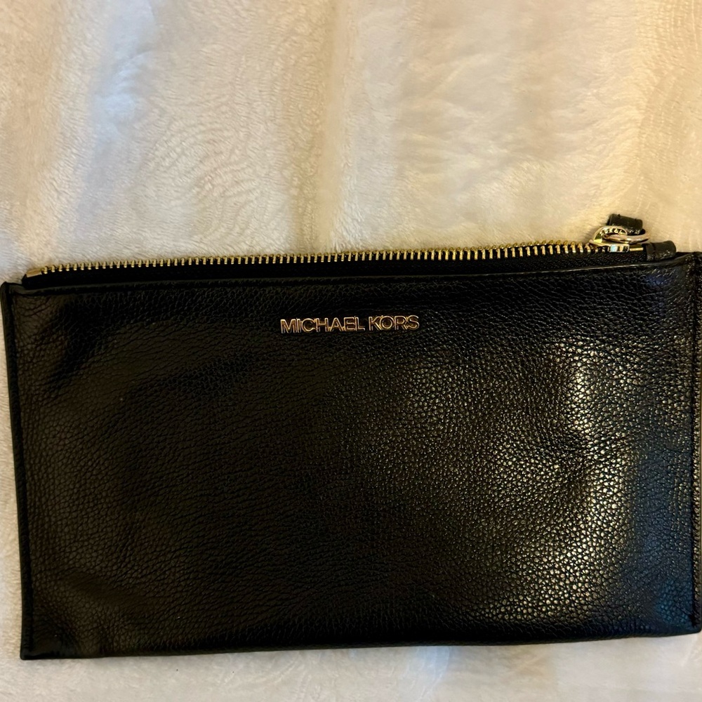 Michael Kors clutch zipper. Black Like New 9.75 inch wide by 5.75 inch height